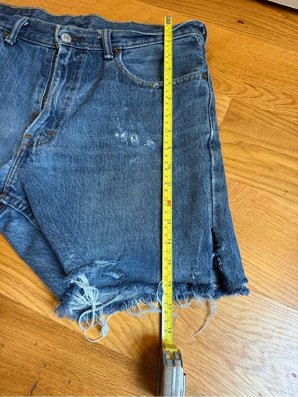 Levi’s Distressed Dark Blue Denim Cutoff Shorts
